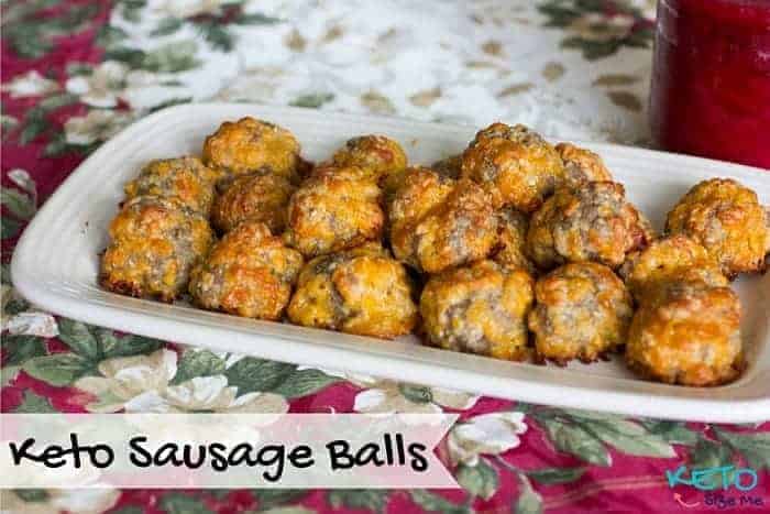 Keto sausage balls on a platter with holiday table cloth