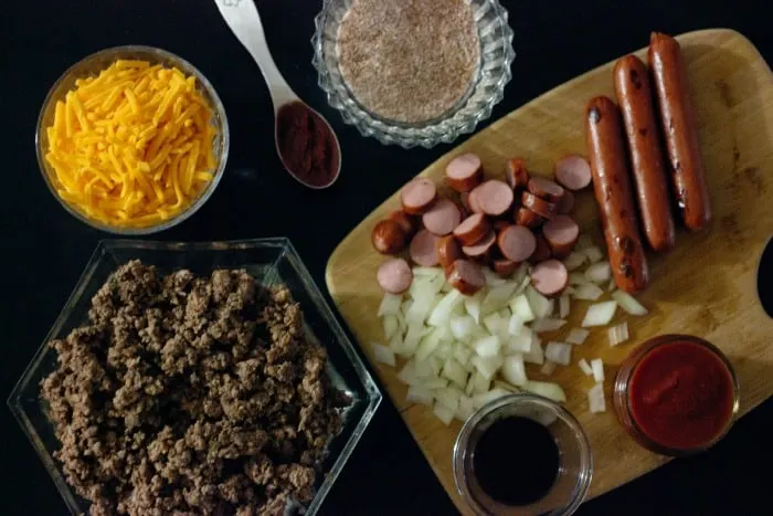 Low Carb High Fat Keto Chili Cheese Dog Casserole. Ground beef, hot dogs, homemade chili, and cheese baked to perfection.