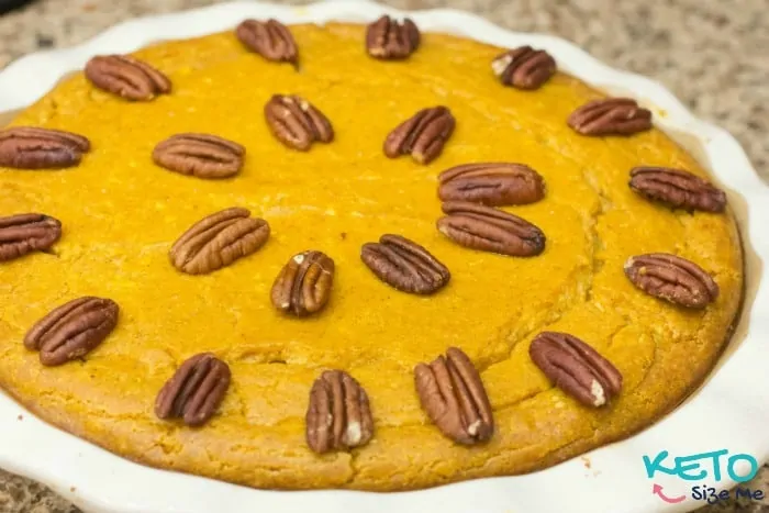 keto pumpkin cheesecake topped with pecans