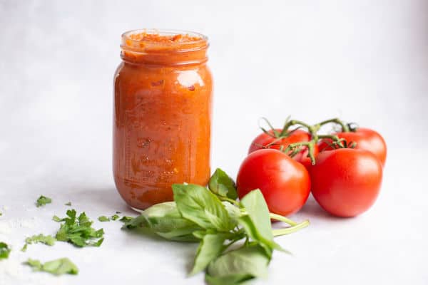 red sauce in a jar with tomatoes