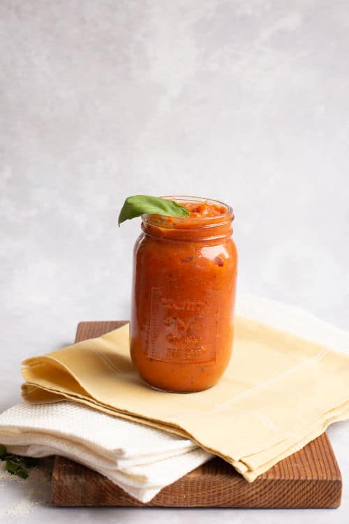 keto tomatoe sauce in a jar on dish towels