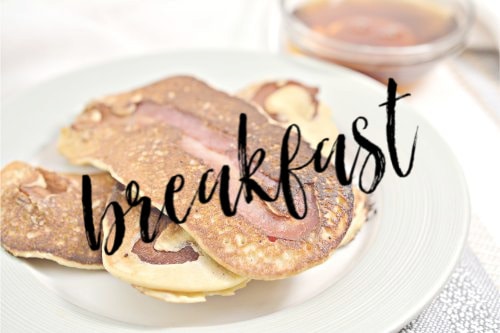 plate of keto  brekfast pancakes filled with bacon with a text overlay that reads breakfast