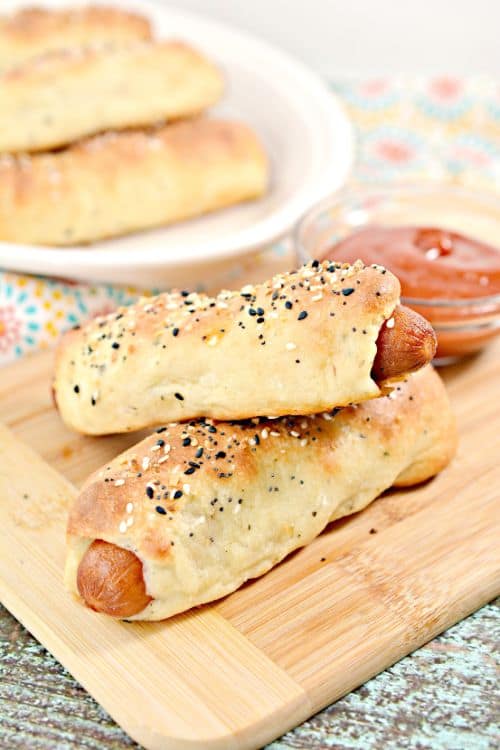Keto Bagel Dogs: Low-Carb Pretzel Dogs with ketchup dipping sauce 