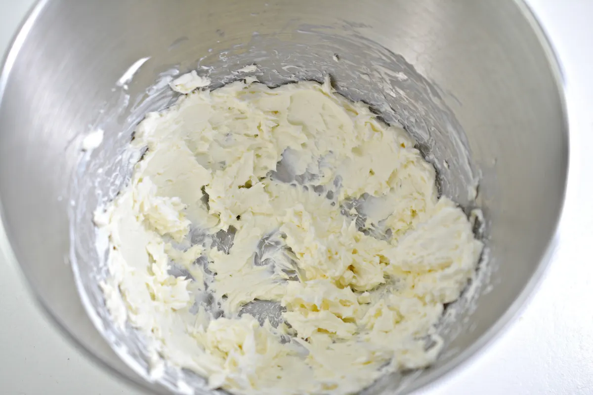beat cream cheese in a mixing bowl